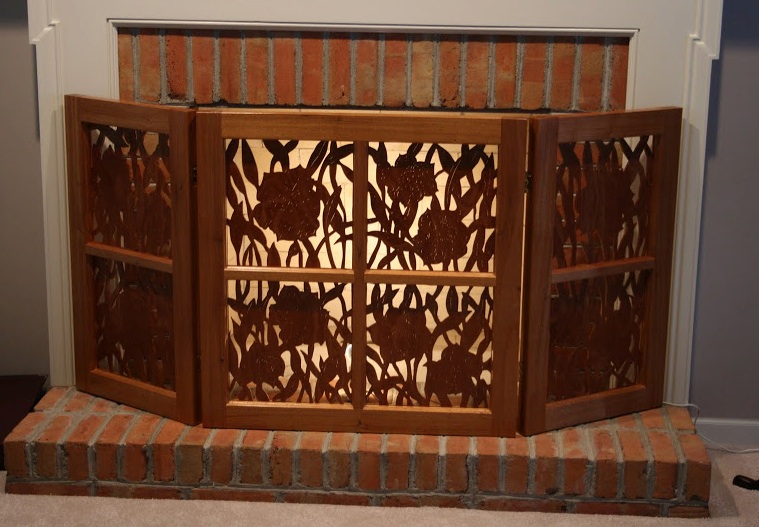 Mahogany fireplace screen by Keith Neer Here's an outstanding Mahogany Fireplace Screen Keith made recently. Careful cutouts are silhouetted by the light behind t he screen.