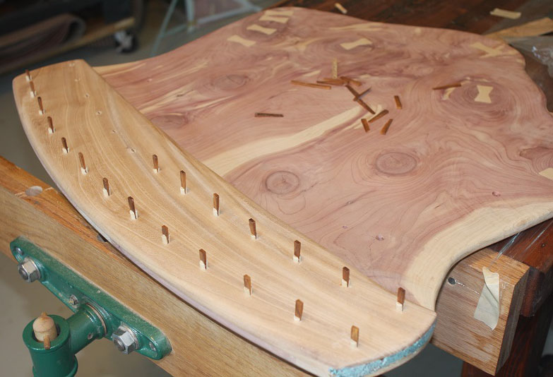 No metal fasteners. Look closely and you'll see Jerry has "pinned" this project together with split dowels and tiny wedges. Wedged dowel fastening