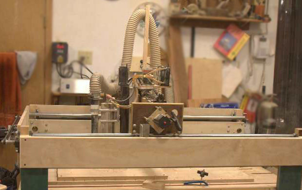 Here's Dennis' "Ace hardware CNC router." Yes, he made it himself with parts from here and there and Ace Hardware. It obviously does a great job as you can see in the intricate bas relief carvings and engraving on his plaques.